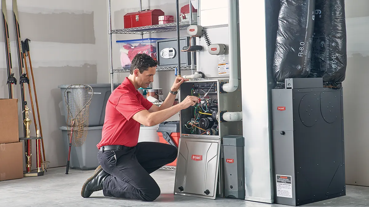 HVAC maintenance technician checking basement electrical | Maintenance and Service Agreements | Emerald Coast Air Conditioning and Heating | AirConditioningRepairPensacola.com